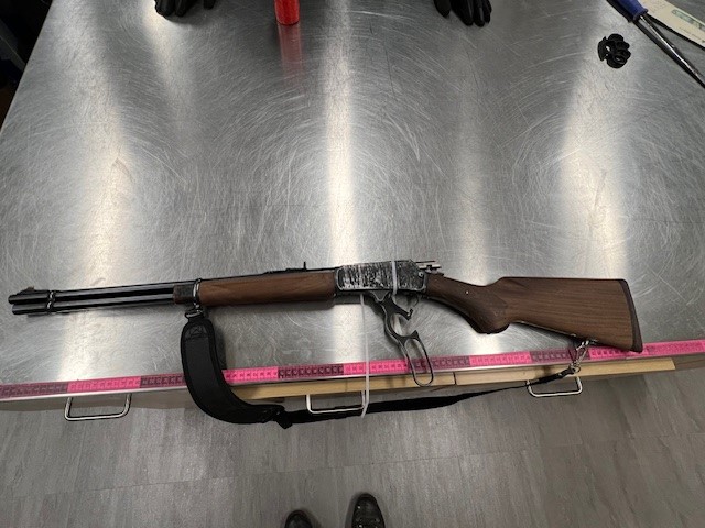 Cochrane RCMP said they seized a rifle, bear spray, brass knuckles and a quantity of illicit drugs after being forced to stop a vehicle using a tire deflation device.
