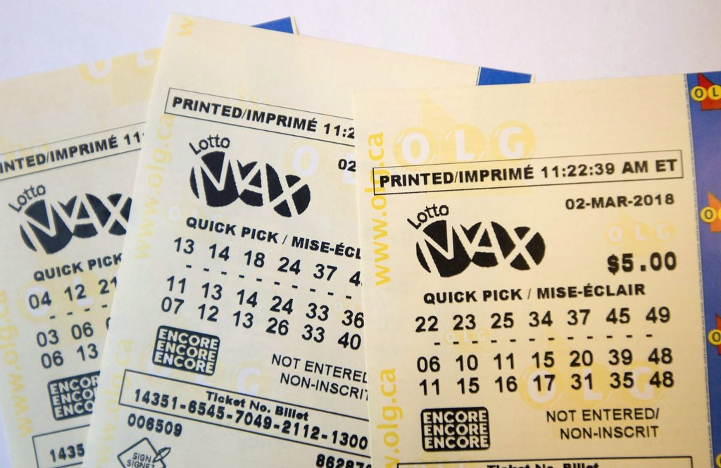 Lotto Max tickets are shown in Toronto on Monday, Feb. 26, 2018.