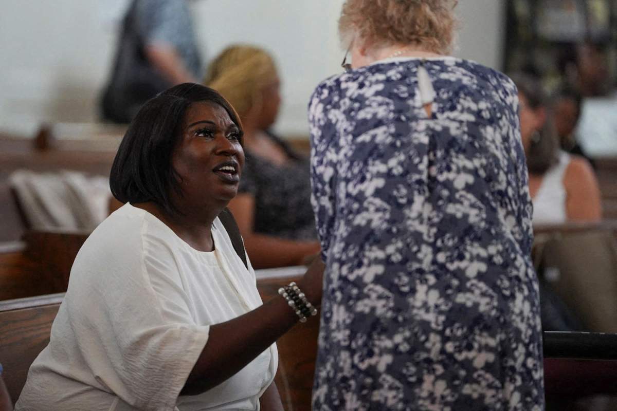 April Newkirk, mother of Adriana Smith, speaks to a woman as family and community members gather on Adriana Smith’s birthday to celebrate her life and rally against Georgia’s ban on abortion, in Atlanta, Georgia, U.S. June 15, 2025.