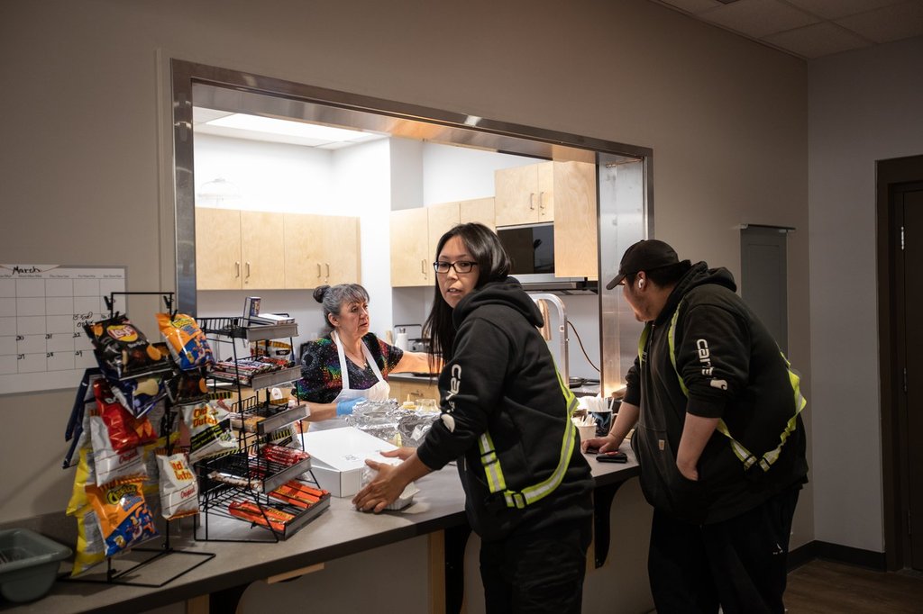 Workers stop for lunch at the arena, one of many amenities and infrastructure projects the Indigenous community of 700 in the oilsands region has been able to finance through relationship with industry, in Fort McKay, Alta., on Thursday April 25, 2024.
