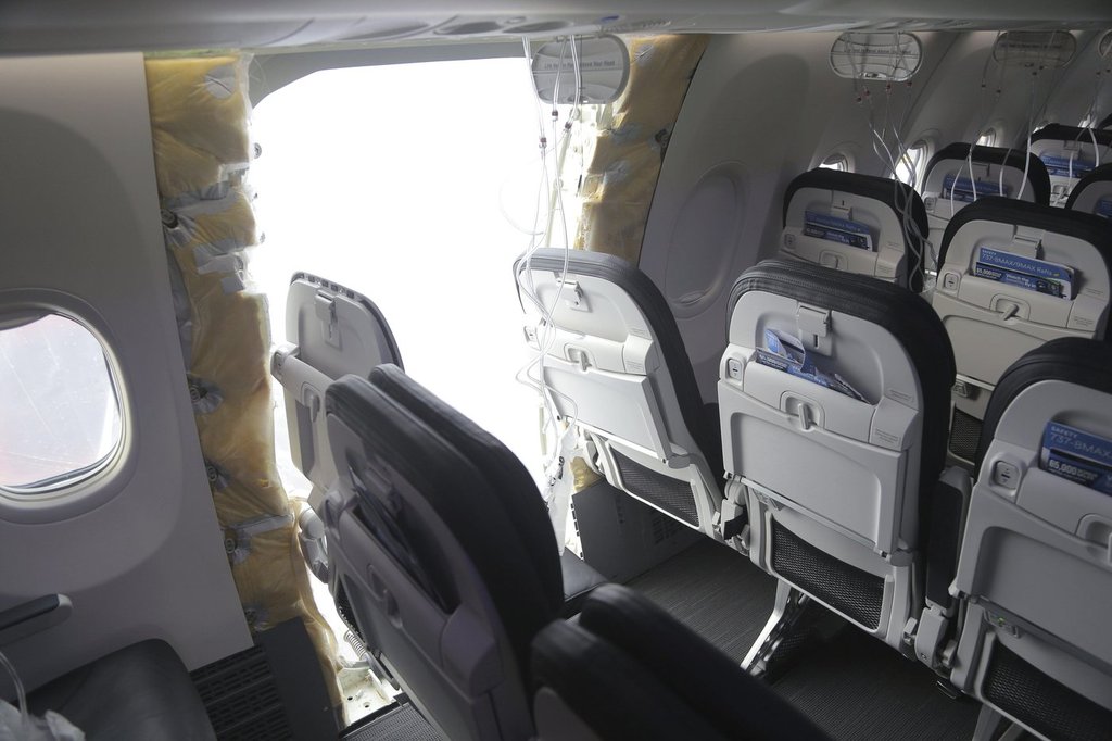 FILE - This image taken Jan. 7, 2024, and released by the National Transportation Safety Board, shows the section of a a Boeing 737 Max where a door plug fell while Alaska Airlines Flight 1282 was in flight.