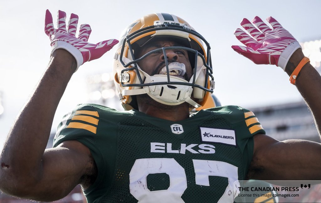 Edmonton Elks' Eugene Lewis celebrates his touchdown during first half CFL football action against the Calgary Stampeders in Calgary, Saturday, Oct. 12, 2024.