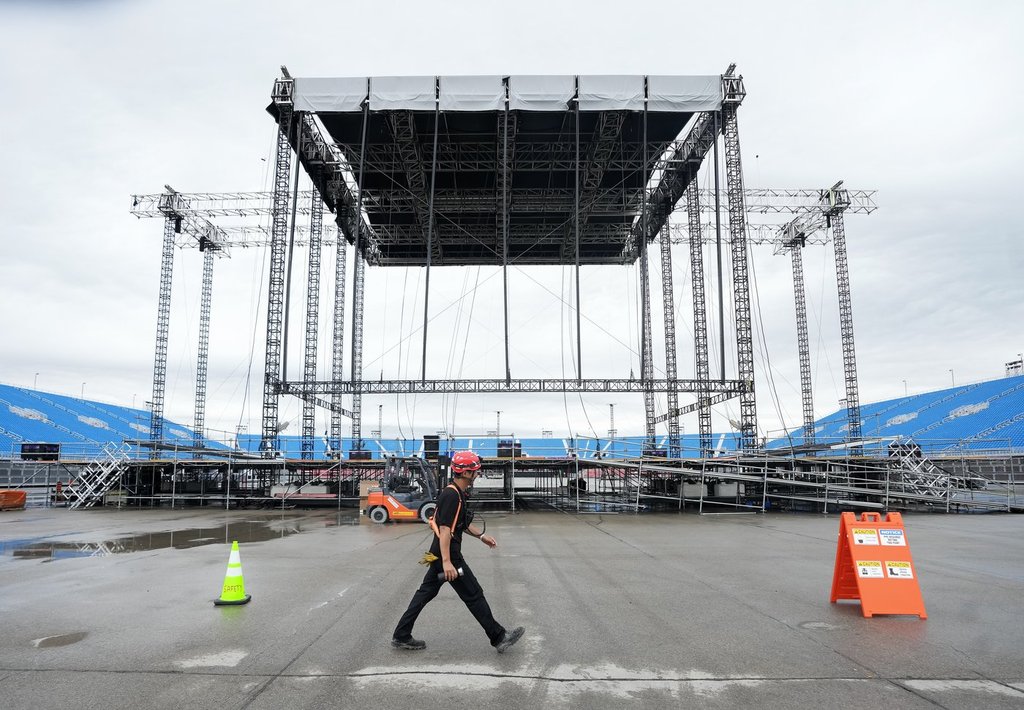 A worker walks past the stage at the brand new 50000 capacity concert venue, Rogers Stadium, in Toronto, Thursday, June 26, 2025. THE CANADIAN PRESS/Nathan Denette