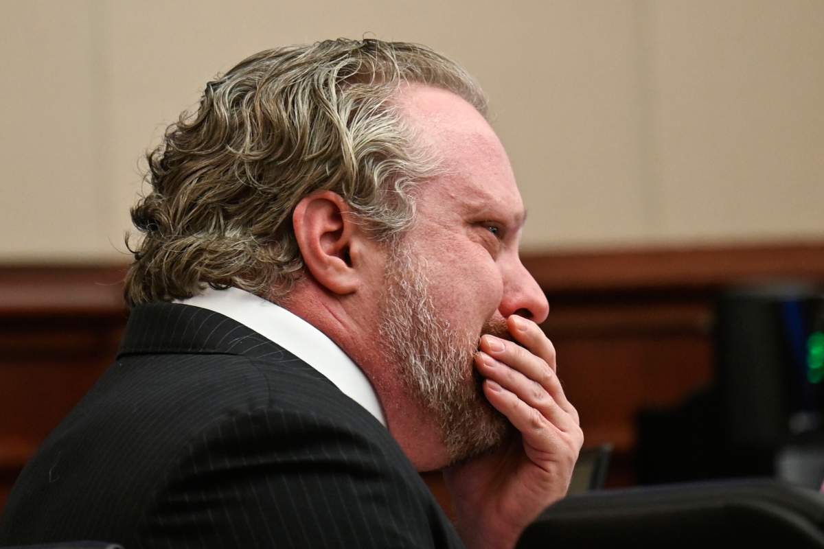 James Craig wipes his face during opening arguments in his murder trial, as he is accused of killing his wife, at the Arapahoe District Court, Tuesday, July 15, 2025, in Centennial, Colo.