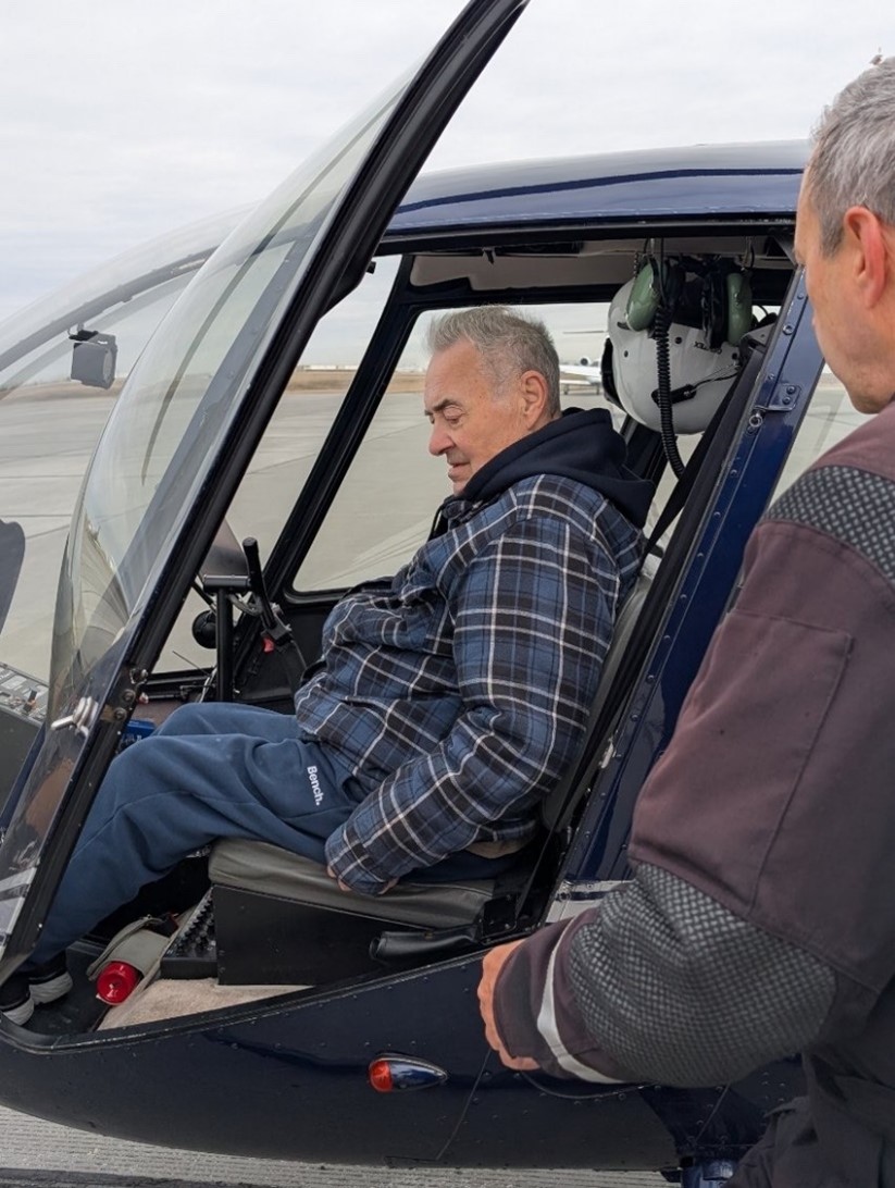 A resident goes on a helicopter ride.