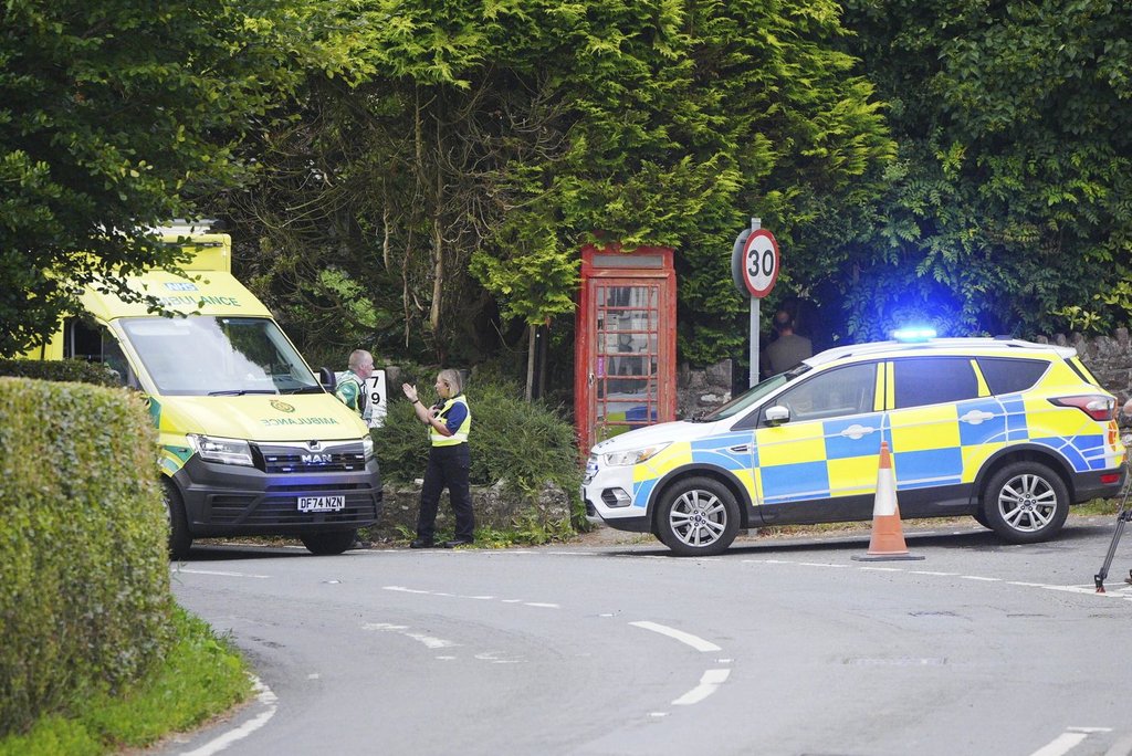 Emergency services operate near the scene of a school bus crash between Wheddon Cross and Timbercombe, near Minehead, England, Thursday, July 17, 2025. (Ben Birchall/PA via AP).