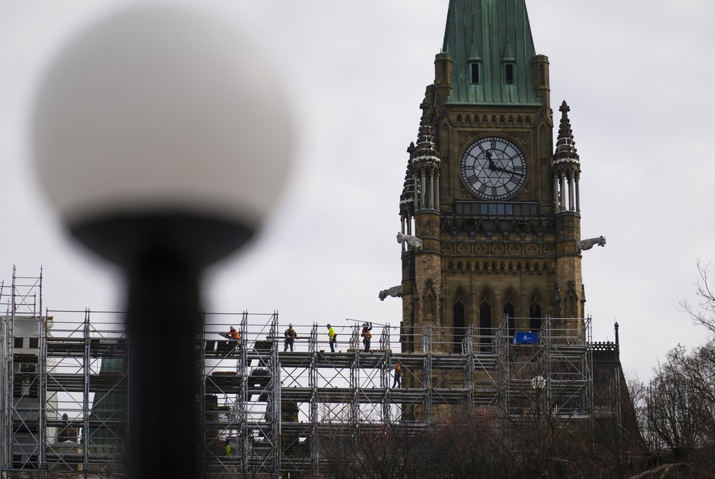 Construction workers build scaffolding on Parliament Hill in Ottawa  on Thursday, March 20, 2025. THE CANADIAN PRESS/Sean Kilpatrick.