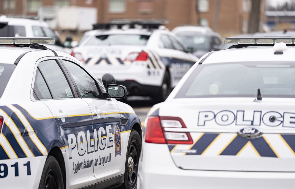 Longueuil police vehicles are parked in Longueuil, Que. Monday, March 4, 2024.