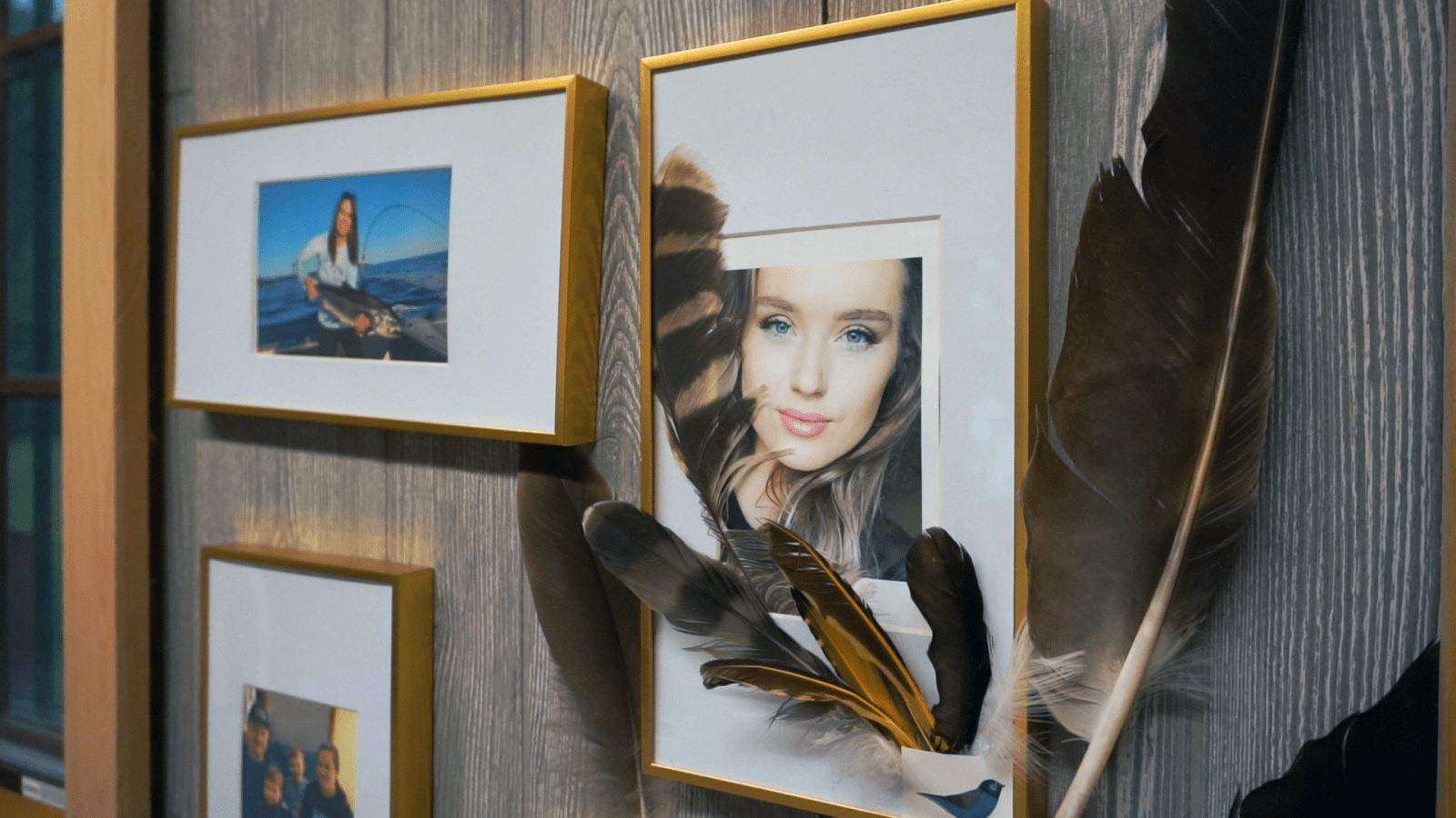 Cally Lester portrait with feathers at Connie's Kenora cabin.