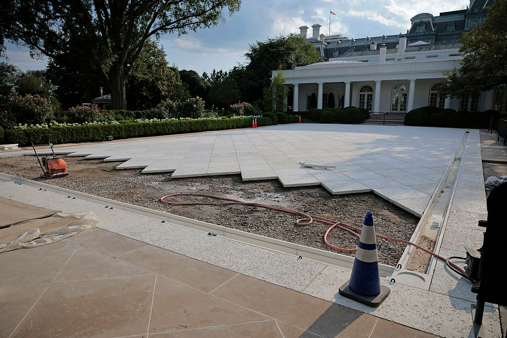 Work continues in paving over the White House Rose Garden lawn on July 23, 2025 in Washington, D.C.