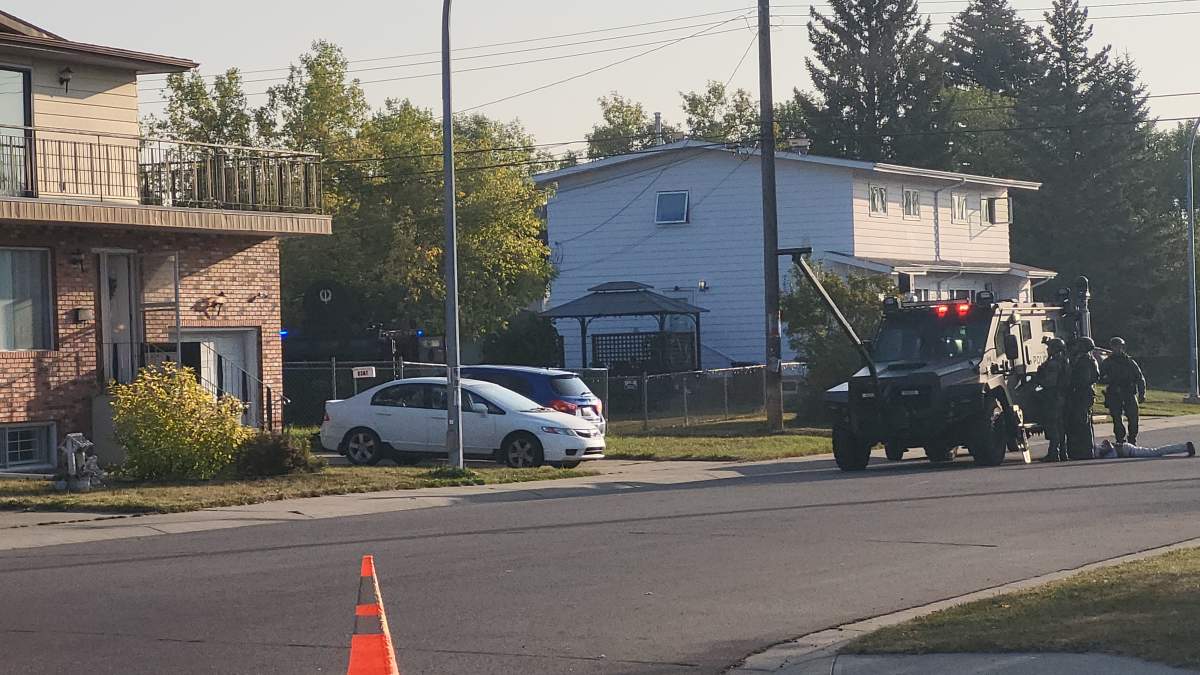 Edmonton Police Service tactical team members at a home in the Canora neighbourhood on Thurs. Sept. 18, 2025.