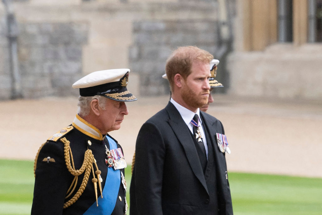 Britain's King Charles III (L) walks with his son Britain's Prince Harry, Duke of Sussex as they arrive at St George's Chapel inside Windsor Castle on September 19, 2022, ahead of the Committal Service for Britain's Queen Elizabeth II.