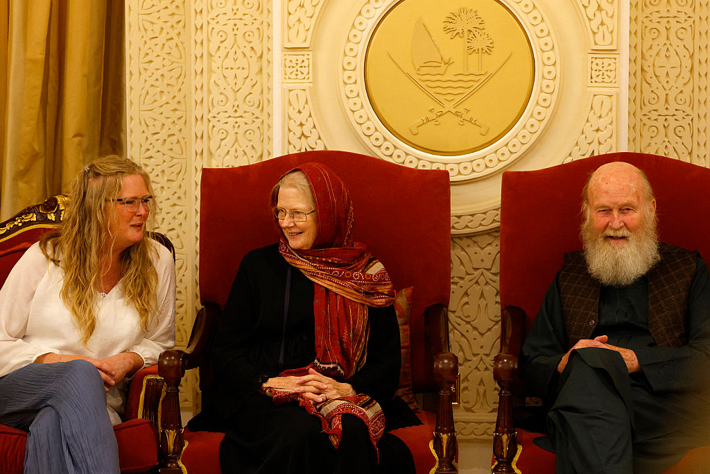 Sarah Entwistle (L) sits with her parents Barbie (C) and Peter Reynolds after landing at the airport in Doha on September 19, 2025. Peter and Barbie Reynolds have been freed in Afghanistan after several months in detention following mediation by Qatar, an official with knowledge of the release told AFP on Friday.