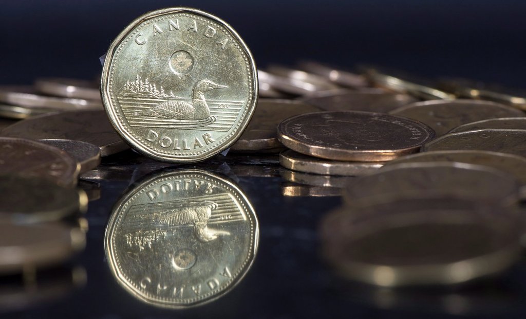 The Canadian dollar coin, the Loonie, is displayed on Friday, Jan. 30, 2015, in Montreal. THE CANADIAN PRESS/Paul Chiasson.
