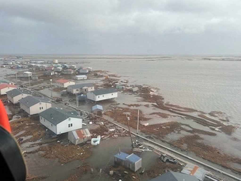 In this photo provided by the U.S. Coast Guard, Kipnuk, Alaska, experiences coastal flooding, Sunday, Oct. 12, 2025.