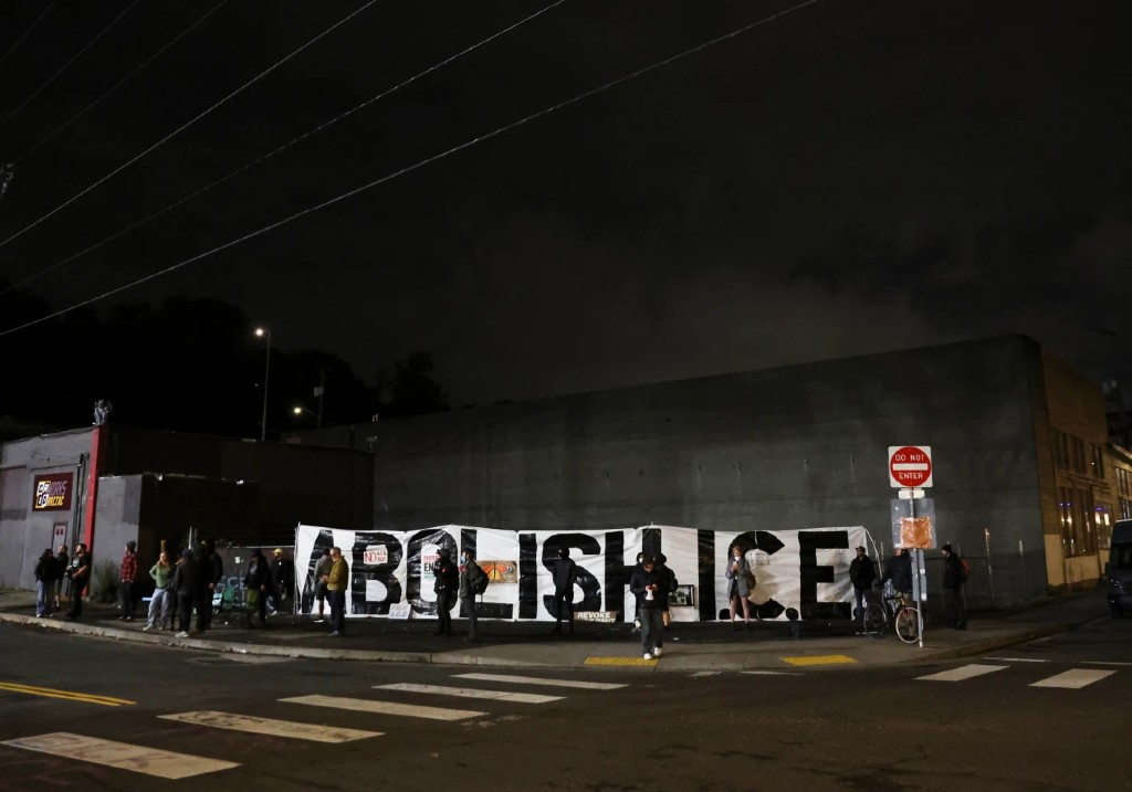 People protest outside a U.S. Immigration and Customs Enforcement facility, in Portland, Oregon, Wednesday, Oct. 1, 2025.