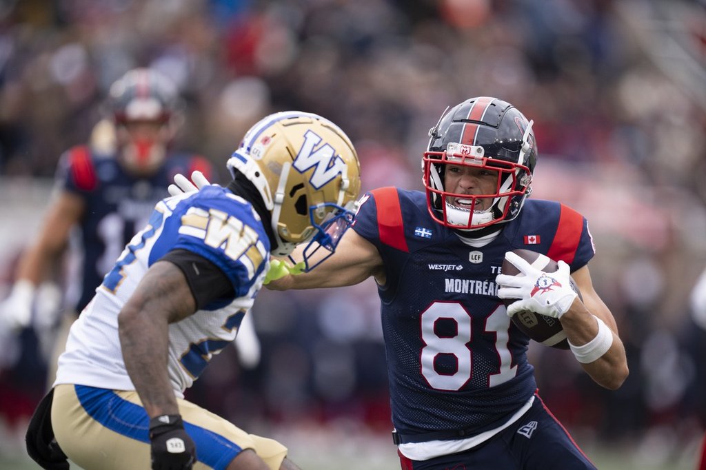 Winnipeg Blue Bombers' Dexter Lawson (27) defends against Montreal Alouettes' Austin MacK (81) during first half Eastern semi-final action, in Montreal on Saturday, Nov. 1, 2025. THE CANADIAN PRESS/Christopher Katsarov.