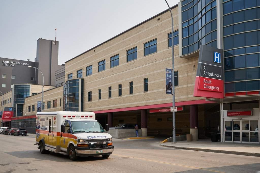 An ambulance drives past Health Sciences Centre Winnipeg on Thursday, June 15, 2023. 