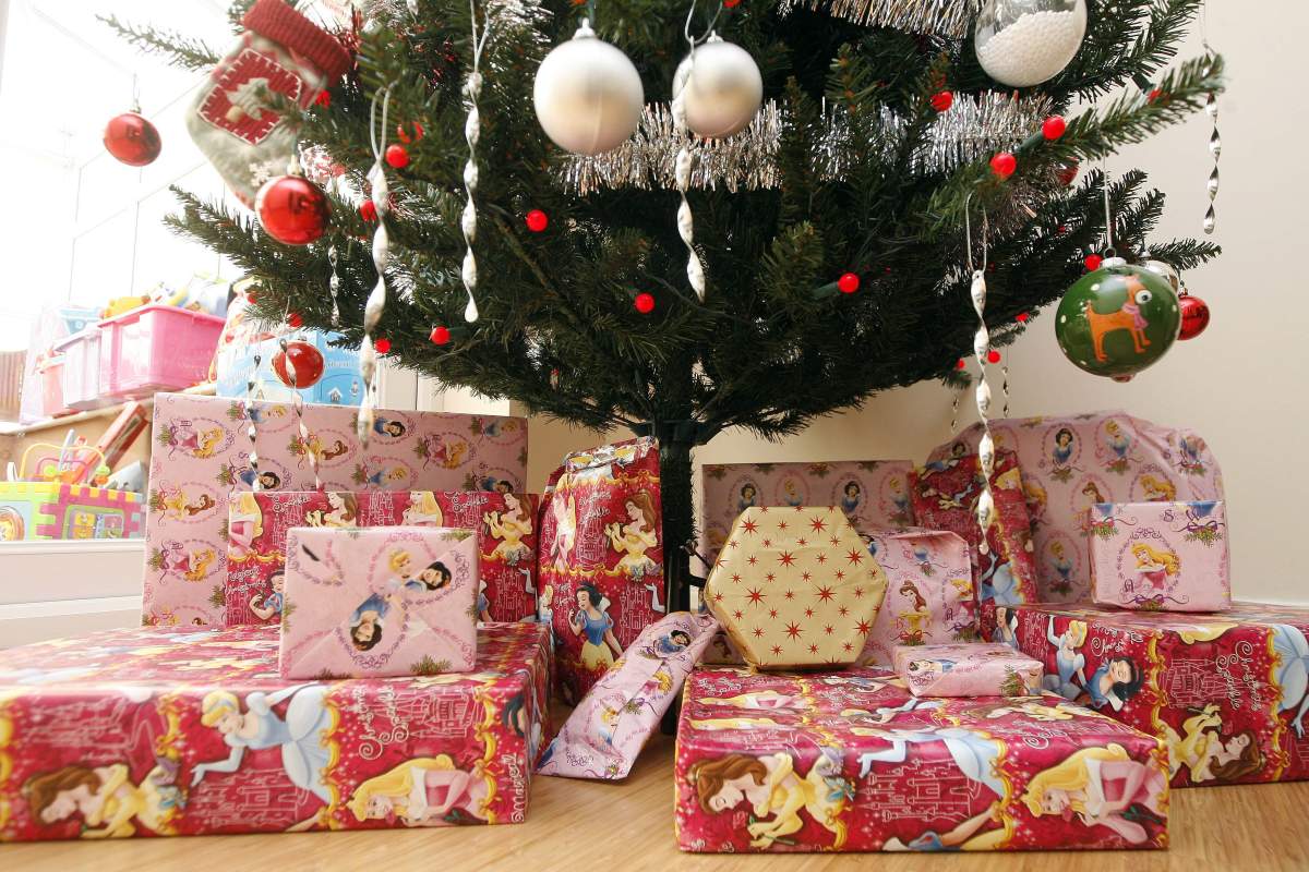Stock photo of a Christmas tree with presents under it.