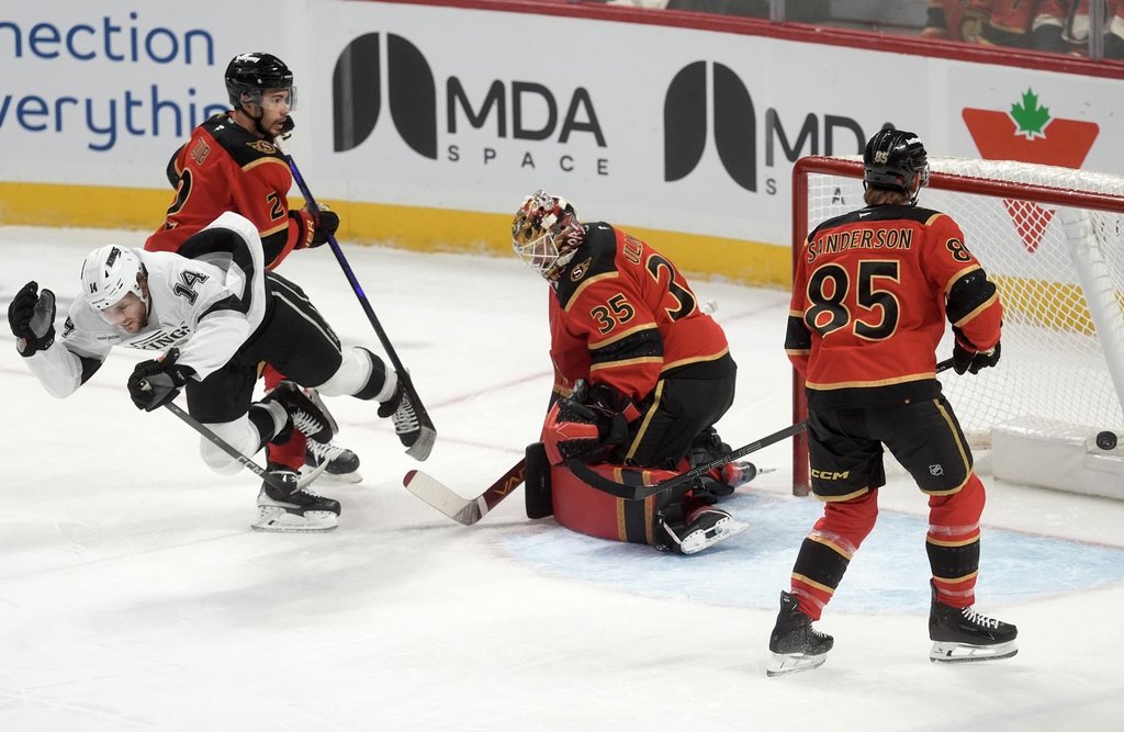 Ottawa Senators defenceman Jake Sanderson (85) and defenceman Artem Zub (2) look on as Los Angeles Kings right wing Alex Laferriere (14) celebrates his goal on goaltender Linus Ullmark (35) as he falls to the ice 
during first period NHL action in Ottawa, Saturday, Nov. 15, 2025. THE CANADIAN PRESS/Adrian Wyld.