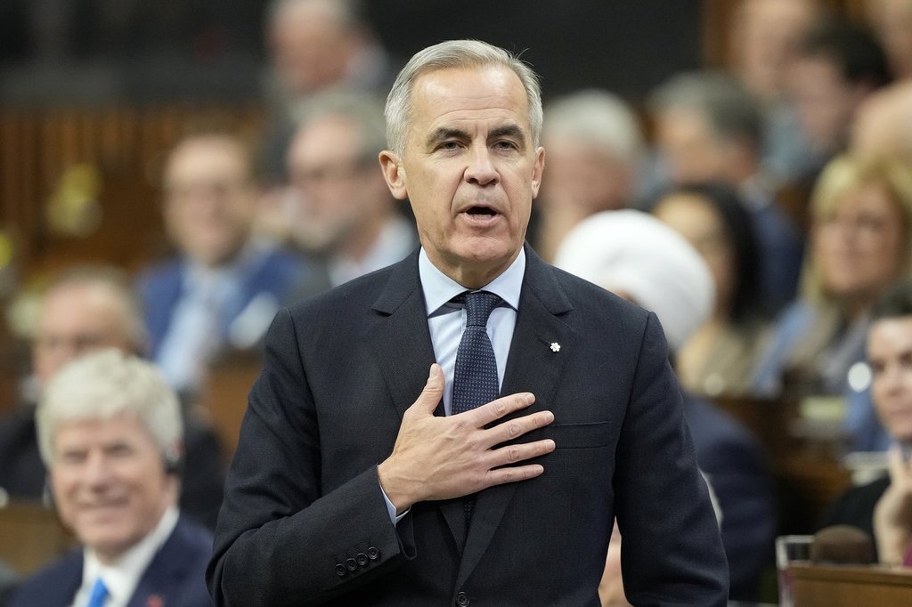 Prime Minister Mark Carney rises during Question Period on Parliament Hill in Ottawa, Tuesday, Nov. 25, 2025. THE CANADIAN PRESS/Adrian Wyld.