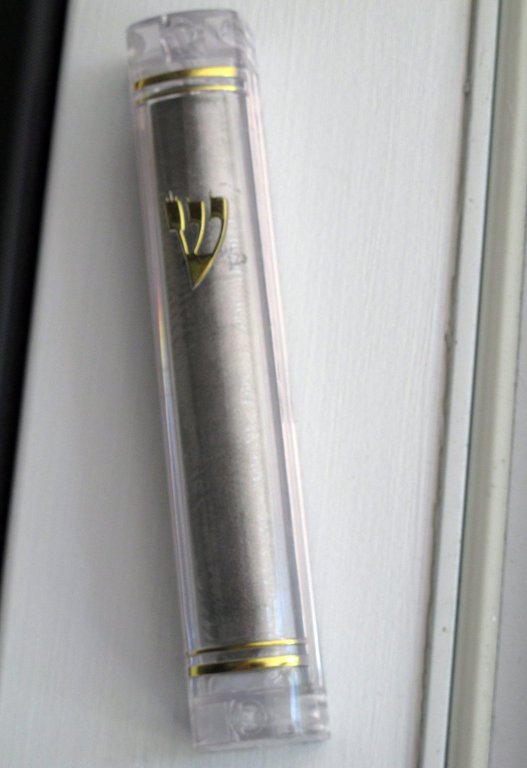 In this June 30, 2013 photo, a new mezuzah hangs in the doorway of a home.