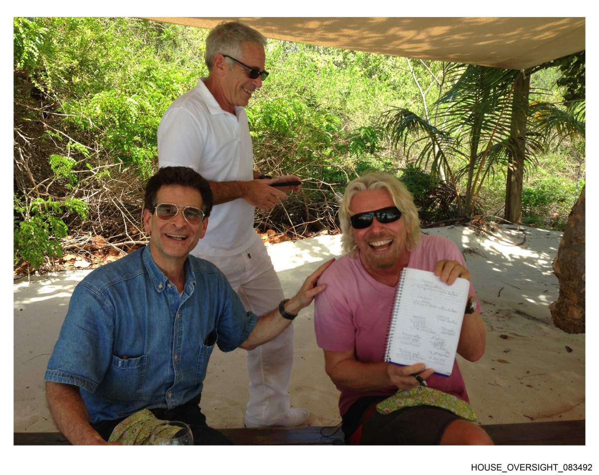 Richard Branson, Epstein and an unidentified man.