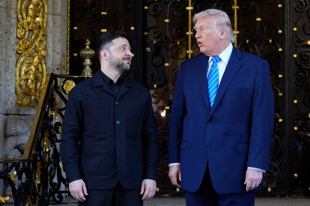 U.S. President Donald Trump greets Ukraine's President Volodymyr Zelenskyy at his Mar-a-Lago club, Sunday, Dec. 28, 2025, in Palm Beach, Fla.