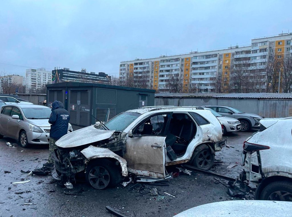 This photo provided by Investigative Committee of Moscow on Monday, Dec. 22, 2025, shows an investigator working at the scene where Lt. Gen. Fanil Sarvarov, head of the Operational Training Directorate of the Russian Armed Forces General Staff, was killed by an explosive device placed under his car in Moscow.