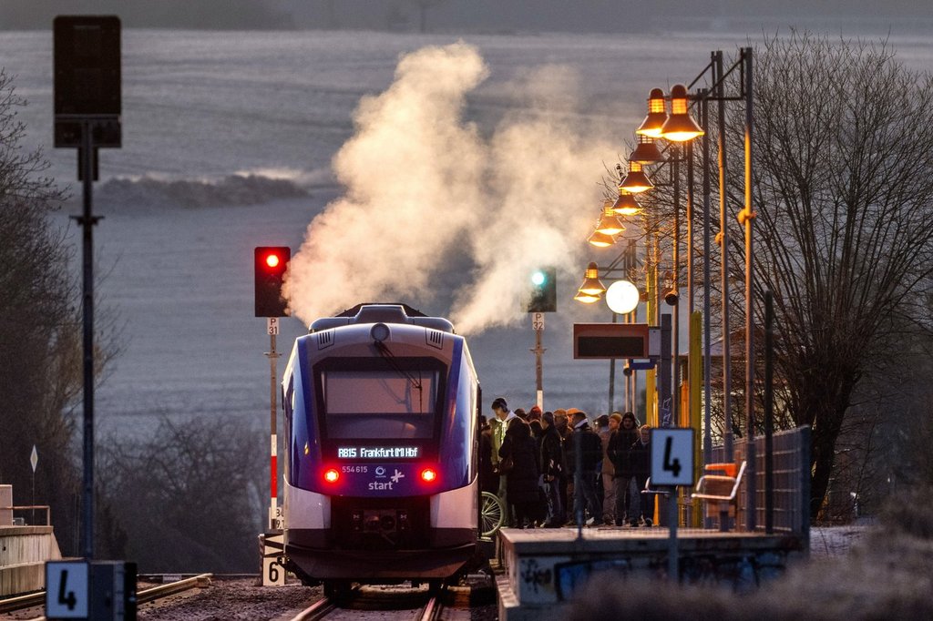 Steam rises from a hydrogen train at a station in Wehrheim near Frankfurt, Germany, early Wednesday, March 5, 2025. (AP Photo/Michael Probst).