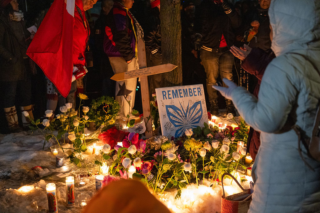 A memorial set up by community members during a vigil following a fatal shooting by an Immigration and Customs Enforcement (ICE) agent in Minneapolis, Minnesota.
