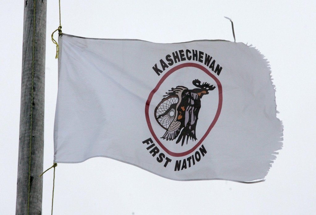 A Kashechewan First Nation flag flies outside St. Paul's Anglican church in northern Ontario, Sunday, Oct. 30, 2005.  THE CANADIAN PRESS/Jonathan Hayward.