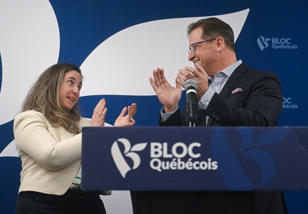 Bloc Quebecois leader Yves-François Blanchet, right, applauds Terrebonne federal byelection candidate Nathalie Sinclair-Desgagne during a news conference in Terrebonne, Que., Thursday, Feb. 26, 2026.