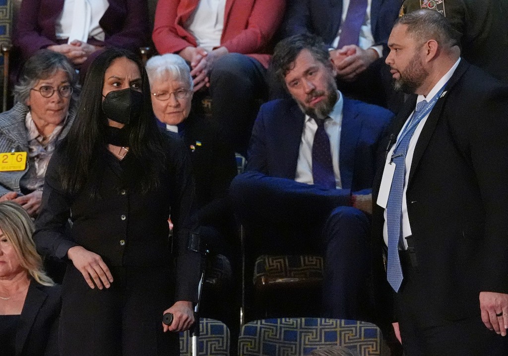 Aliya Rahman is removed from the House chamber as President Donald Trump delivers the State of the Union address to a joint session of Congress at the U.S. Capitol in Washington, Tuesday, Feb. 24, 2026.