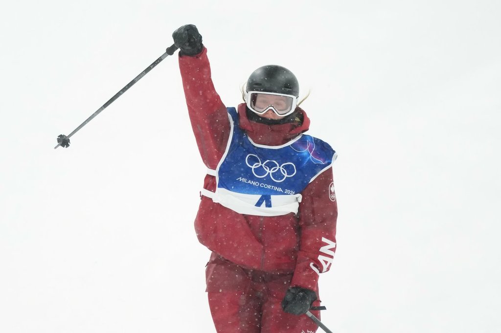 Canada's Megan Oldham pumps her fist as she comes into the finish zone following her first run in the women's free ski big air at the Milan Cortina 2026 Winter Olympic Games in Livigno, Italy on Monday, Feb. 16, 2026. THE CANADIAN PRESS/Sean Kilpatrick.