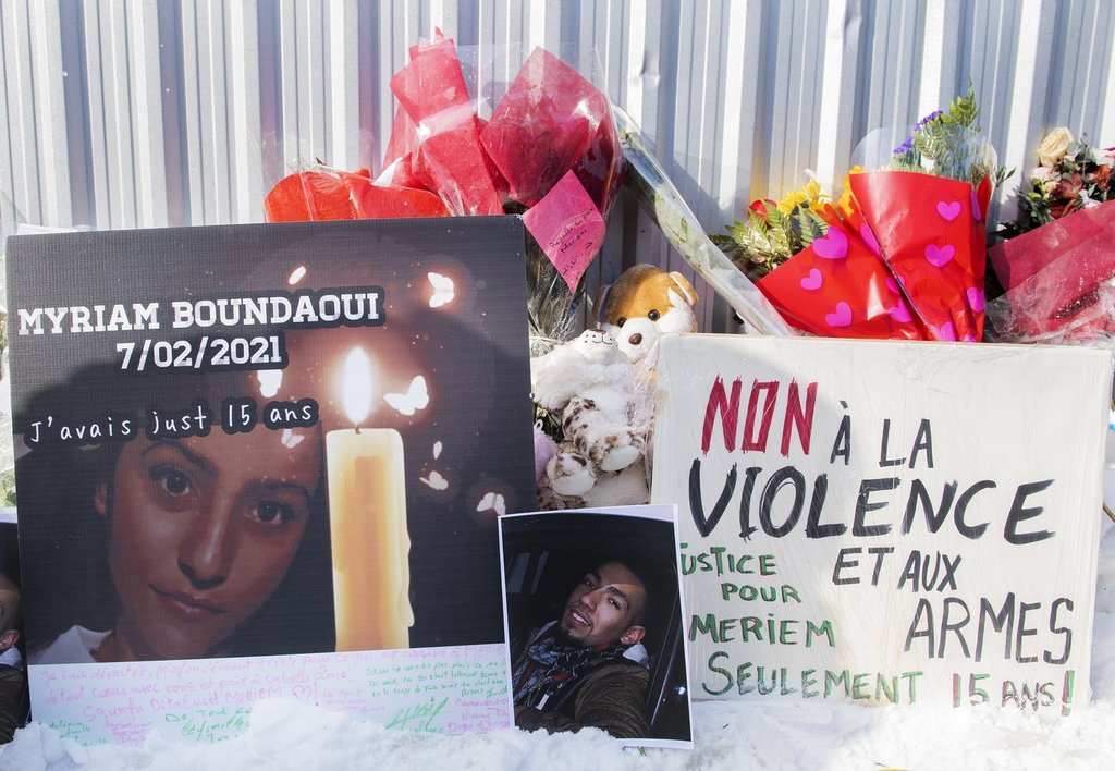 A makeshift memorial is shown during a vigil and protest against gun violence in memory of Meriem Boundaoui in Montreal, Sunday, Feb. 14, 2021. 