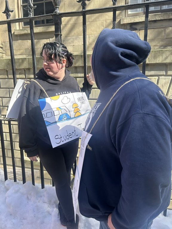 Teddie Rofe, a high school student, protests in front of the Nova Scotia legislature amid the provincial government’s planned cut to the student bus pass program. THE CANADIAN PRESS/Handout – Heidi Rofe (Mandatory Credit)