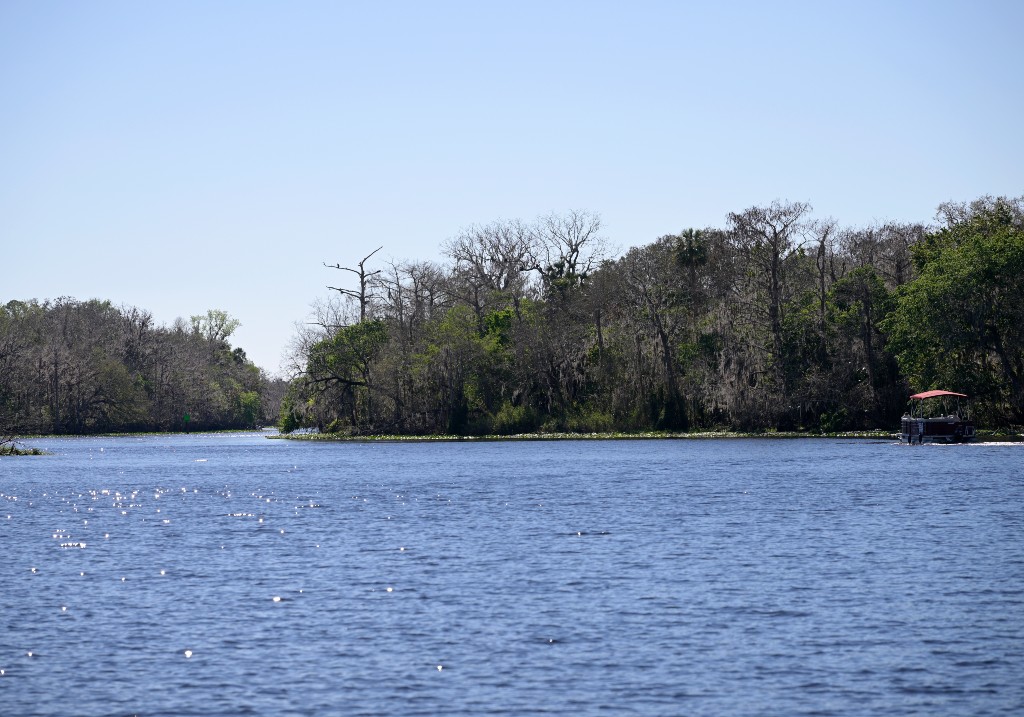 A file photo of a boat making its way along the St. Johns River, Monday, Feb. 13, 2023, in Orange City, Fla.