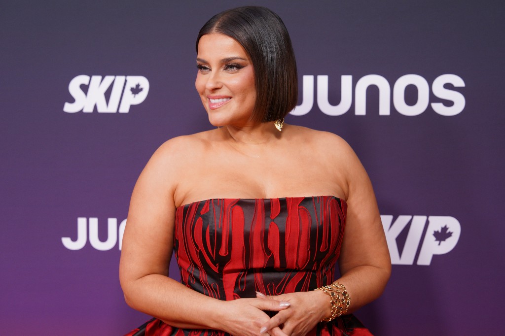Nelly Furtado, nominated for Pop Album of the Year, and Recipient of the Canadian Music Hall of Fame honour, poses on the orange carpet at the Junos in Hamilton, Ontario, Canada on Sunday, March 29, 2026.