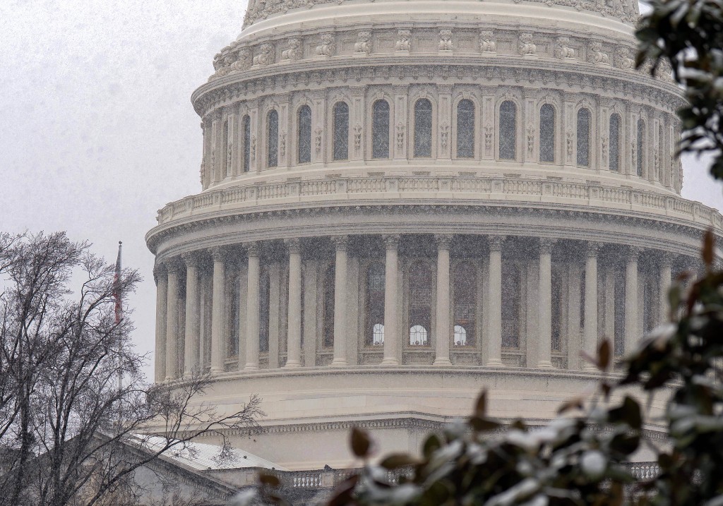 The U.S. Capitol is seen during a snowy day on Capitol Hill Thursday, March 12, 2026, in Washington.