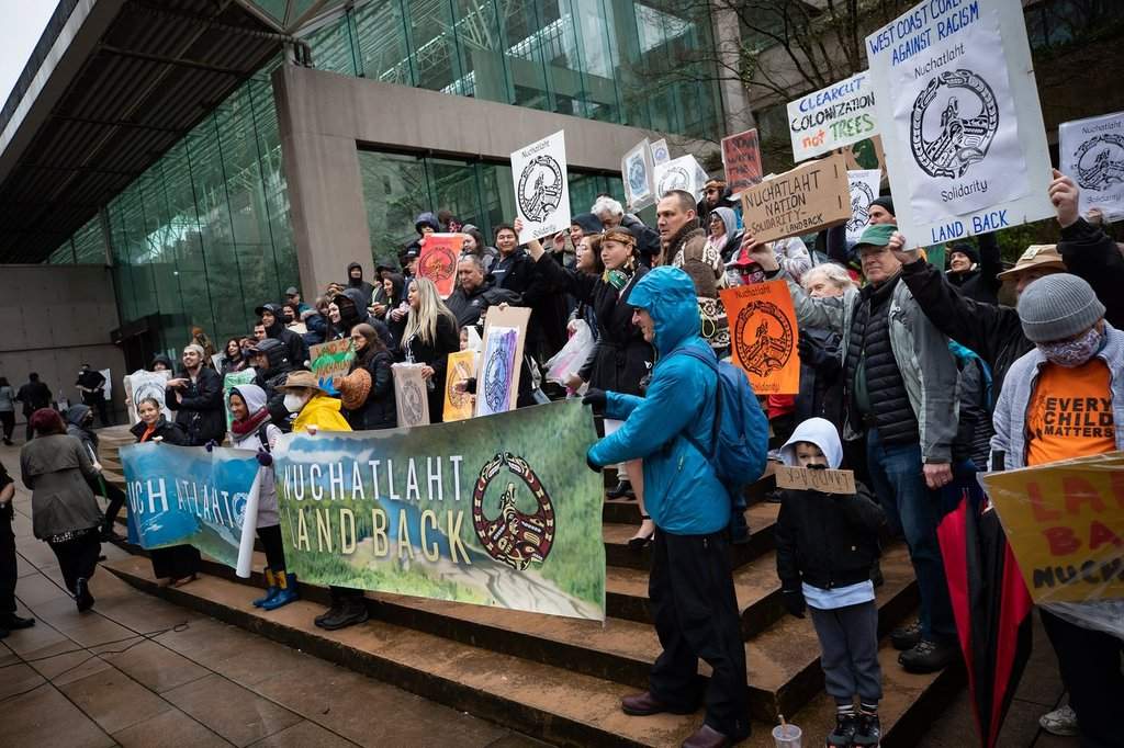 Members of the Nuchatlaht First Nation and supporters rally outside B.C. Supreme Court before the start of an Indigenous land title case, in Vancouver, on Monday, March 21, 2022. The lawsuit brought by the First Nation against the provincial government seeks to reclaim part of its territory on Nootka Island, off the west coast of Vancouver Island. THE CANADIAN PRESS/.