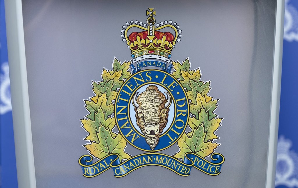The RCMP logo is seen at a news conference, in St. John's, N.L., on June 24, 2023. THE CANADIAN PRESS/Adrian Wyld.