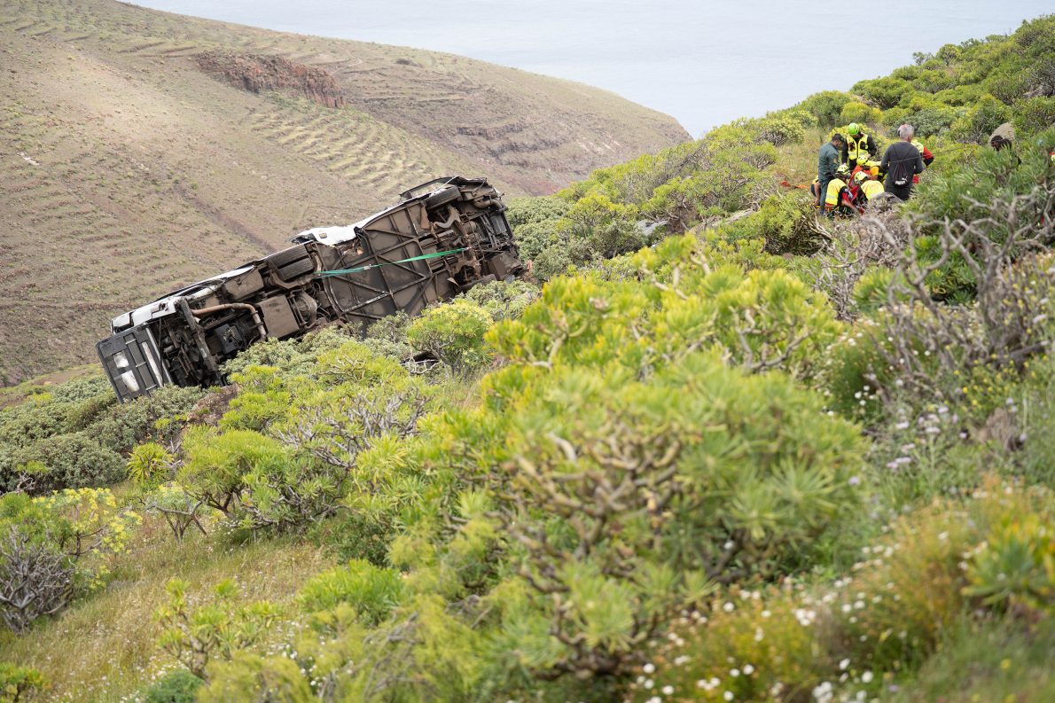 Rescuers work at the scene of a bus crash near in San Sebastian de La Gomera, in Spain's Canary Islands, Friday, April 10, 2026. (Europa Press Canarias/Europa Press via AP).