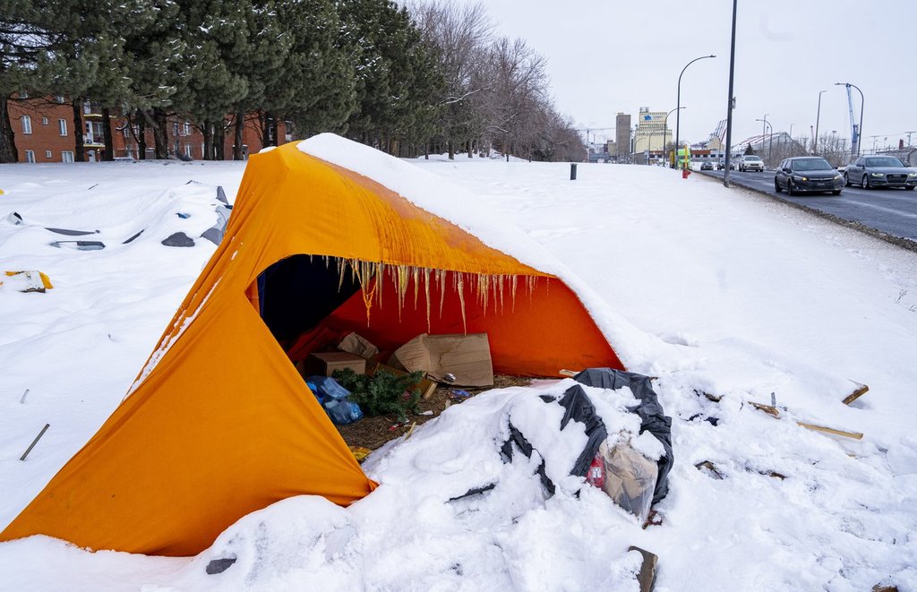 Tents are seen at an unhoused encampment in Montreal on Friday, Feb. 27, 2026. THE CANADIAN PRESS/Christinne Muschi.