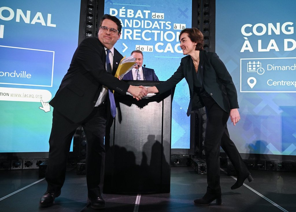 Coalition Avenir Québec (CAQ) leadership candidates Christine Frechette and Bernard Drainville shake hands following a leadership debate in Laval, Que., Saturday, March 28, 2026. THE CANADIAN PRESS/Graham Hughes.
