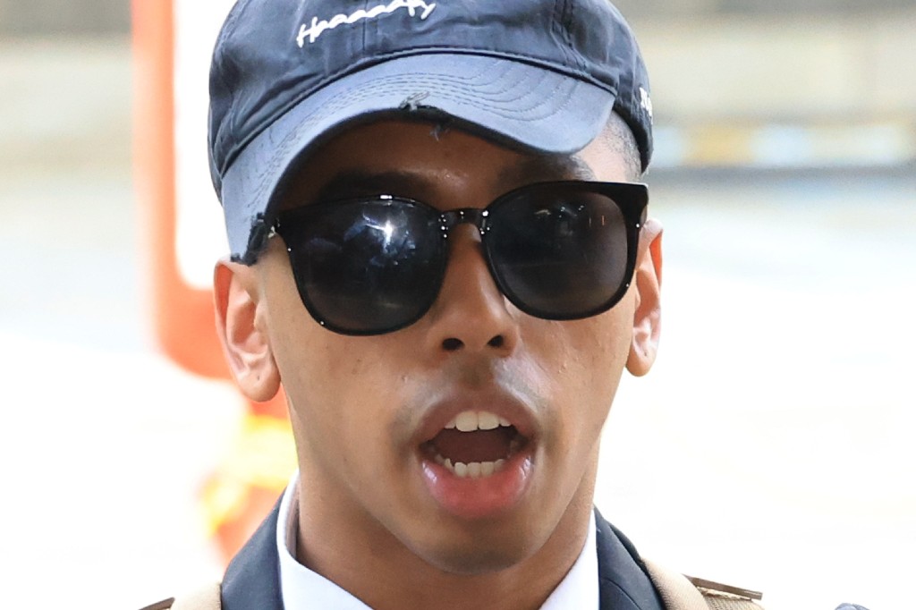 American YouTuber Johnny Somali speaks to reporters as he arrives at the Seoul Western District Court in Seoul, South Korea, Wednesday, April 15, 2026.