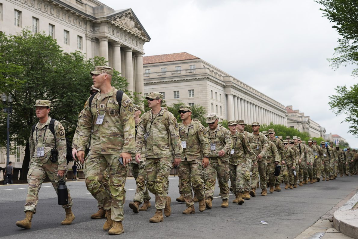 U.S. army soldiers walk along Constitution Avenue on the National Mall ahead of a parade commemorating the army's 250th anniversary and coinciding with President Donald Trump's 79th birthday, on June 14, 2025, in Washington. (AP Photo/Pablo Martinez Monsivais).