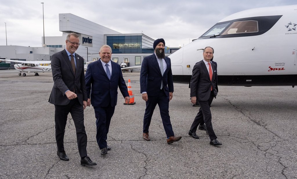 Toronto Port Authority President and CEO RJ Steenstra, left to right, Ontario Premier Doug Ford, Ontario Transportation Minister Prabmeet Singh Sarkaria and Ontario Finance Minister Peter Bethlenfalvy arrive at an event at Billy Bishop Toronto City Airport on Monday March 23, 2026. 