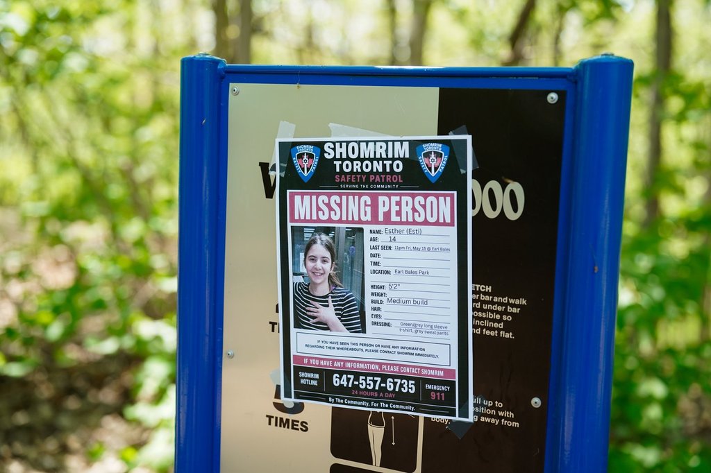 A poster of missing 14-year-old Esther is seen in Earl Bales Park in Toronto on Tuesday, May 19, 2026. THE CANADIAN PRESS/Arlyn McAdorey