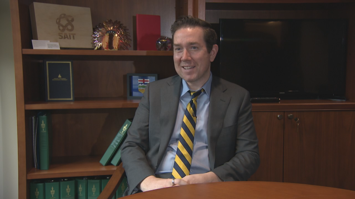 Calgary Confederation MP sits in his office